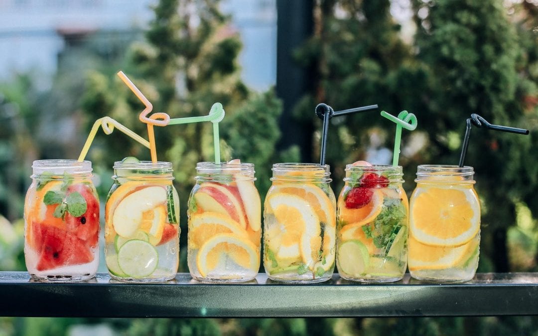six fruit cocktail jar glasses with straws