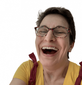 Woman's face with glasses on laughing